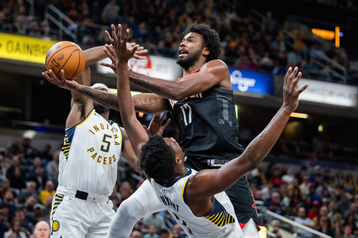 Mar 4, 2025; Indianapolis, Indiana, USA; Houston Rockets forward Tari Eason (17) shoots the ball while Indiana Pacers center Thomas Bryant (3) defends in the first half at Gainbridge Fieldhouse. Mandatory Credit: Trevor Ruszkowski-Imagn Images