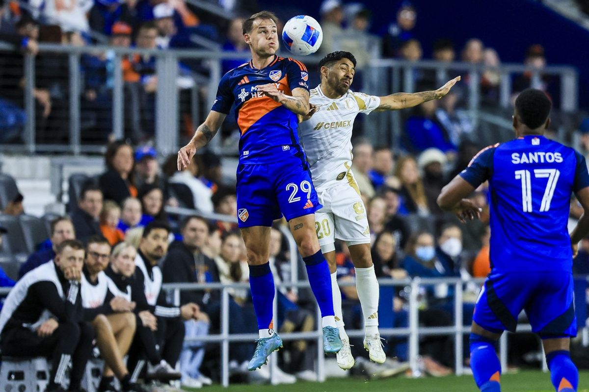 Mar 4, 2025; Cincinnati, Ohio, USA; FC Cincinnati defender Lukas Engel (29) heads the ball against Tigres UANL midfielder Javier Aquino (20) in the second half at TQL Stadium. Mandatory Credit: Katie Stratman-Imagn Images