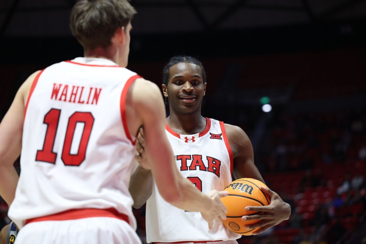 Mar 4, 2025; Salt Lake City, Utah, USA; Utah Utes forward Ezra Ausar (2) reacts to a play with forward Jake Wahlin (10) during the first half of the game against the West Virginia Mountaineers at Jon M. Huntsman Center. Mandatory Credit: Rob Gray-Imagn Images