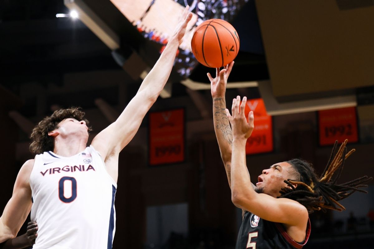 Mar 4, 2025; Charlottesville, Virginia, USA; Florida State Seminoles guard Daquan Davis (5) shoots the ball while Virginia Cavaliers forward Blake Buchanan (0) defends in the first half at John Paul Jones Arena. Mandatory Credit: Emily Faith Morgan-Imagn Images