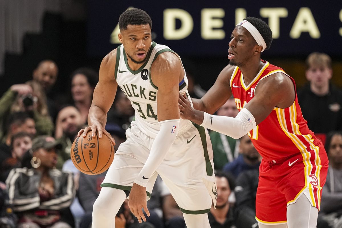 Mar 4, 2025; Atlanta, Georgia, USA; Milwaukee Bucks forward Giannis Antetokounmpo (34) controls the ball against Atlanta Hawks forward Onyeka Okongwu (17) during the second half at State Farm Arena. Mandatory Credit: Dale Zanine-Imagn Images