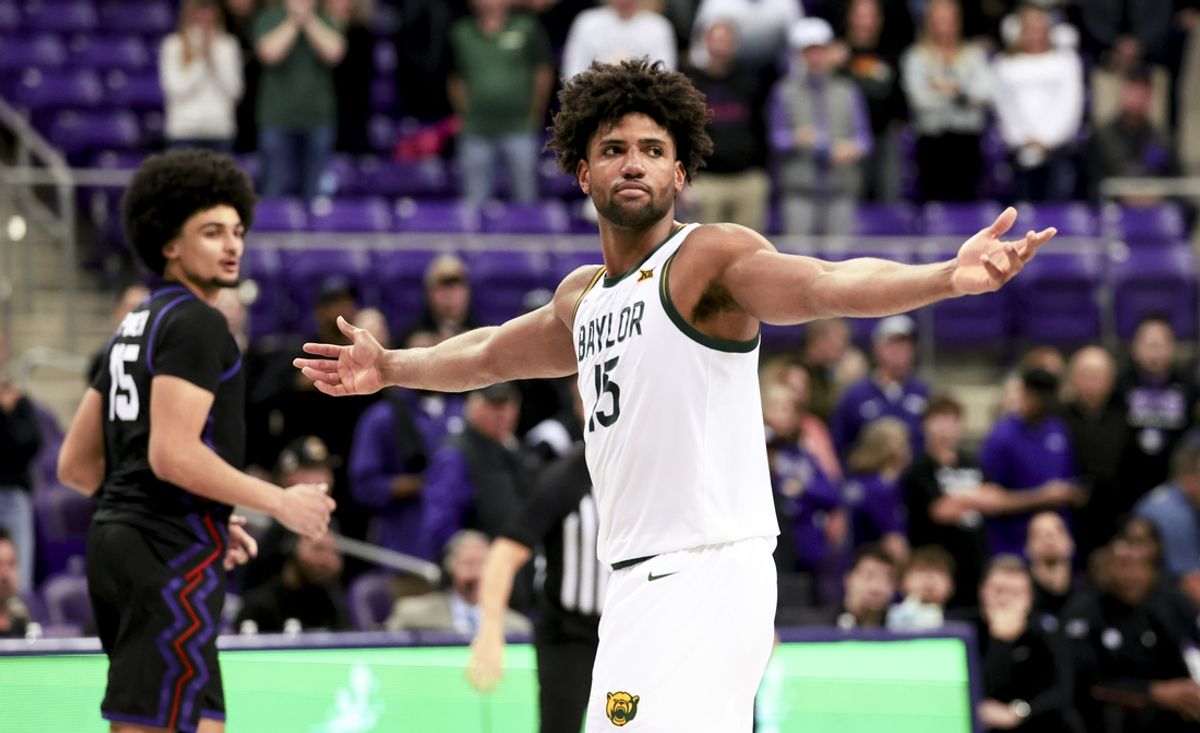 Mar 4, 2025; Fort Worth, Texas, USA;  Baylor Bears forward Norchad Omier (15) reacts in front of TCU Horned Frogs forward David Punch (15) during the second half at Ed and Rae Schollmaier Arena. Mandatory Credit: Kevin Jairaj-Imagn Images
