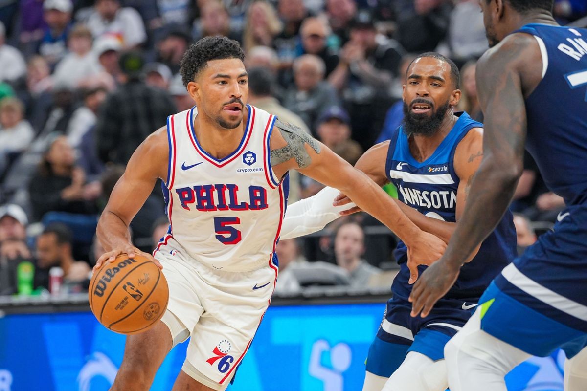 Mar 4, 2025; Minneapolis, Minnesota, USA; Philadelphia 76ers guard Quentin Grimes (5) dribbles against the Minnesota Timberwolves guard Mike Conley (10) in the third quarter at Target Center. Mandatory Credit: Brad Rempel-Imagn Images