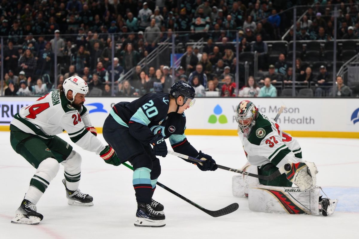 Mar 4, 2025; Seattle, Washington, USA; Minnesota Wild goaltender Filip Gustavsson (32) blocks a goal shot by Seattle Kraken right wing Eeli Tolvanen (20) during the first period at Climate Pledge Arena. Mandatory Credit: Steven Bisig-Imagn Images