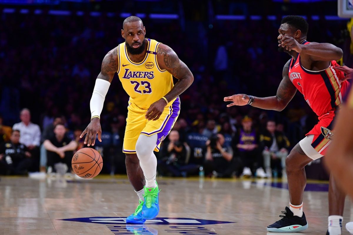 Mar 4, 2025; Los Angeles, California, USA; Los Angeles Lakers forward LeBron James (23) moves the ball against New Orleans Pelicans forward Zion Williamson (1) during the first half at Crypto.com Arena. Mandatory Credit: Gary A. Vasquez-Imagn Images