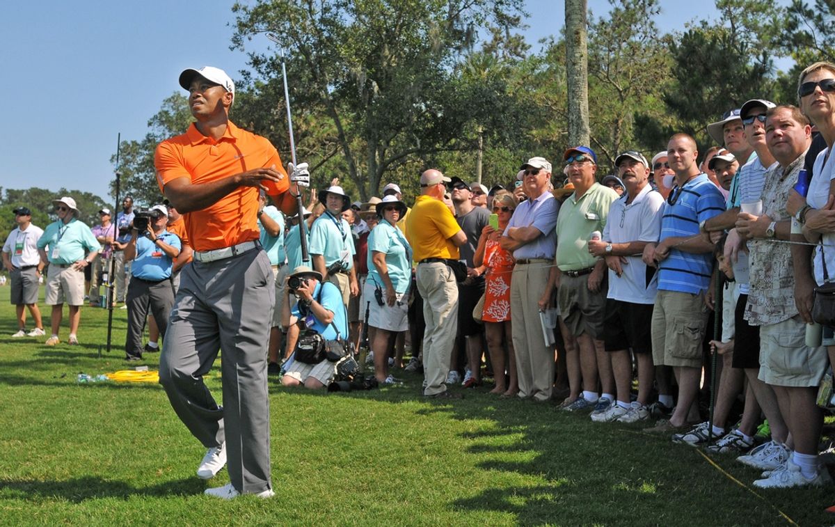 Tiger Woods chips from the edge of the gallery on hole No. 9 in the first round of The Players Championship at TPC Sawgrass Players Stadium Course in Ponte Vedra Beach, Florida, on Thursday, May 9, 2013. [Bob Self/Florida Times-Union/File]