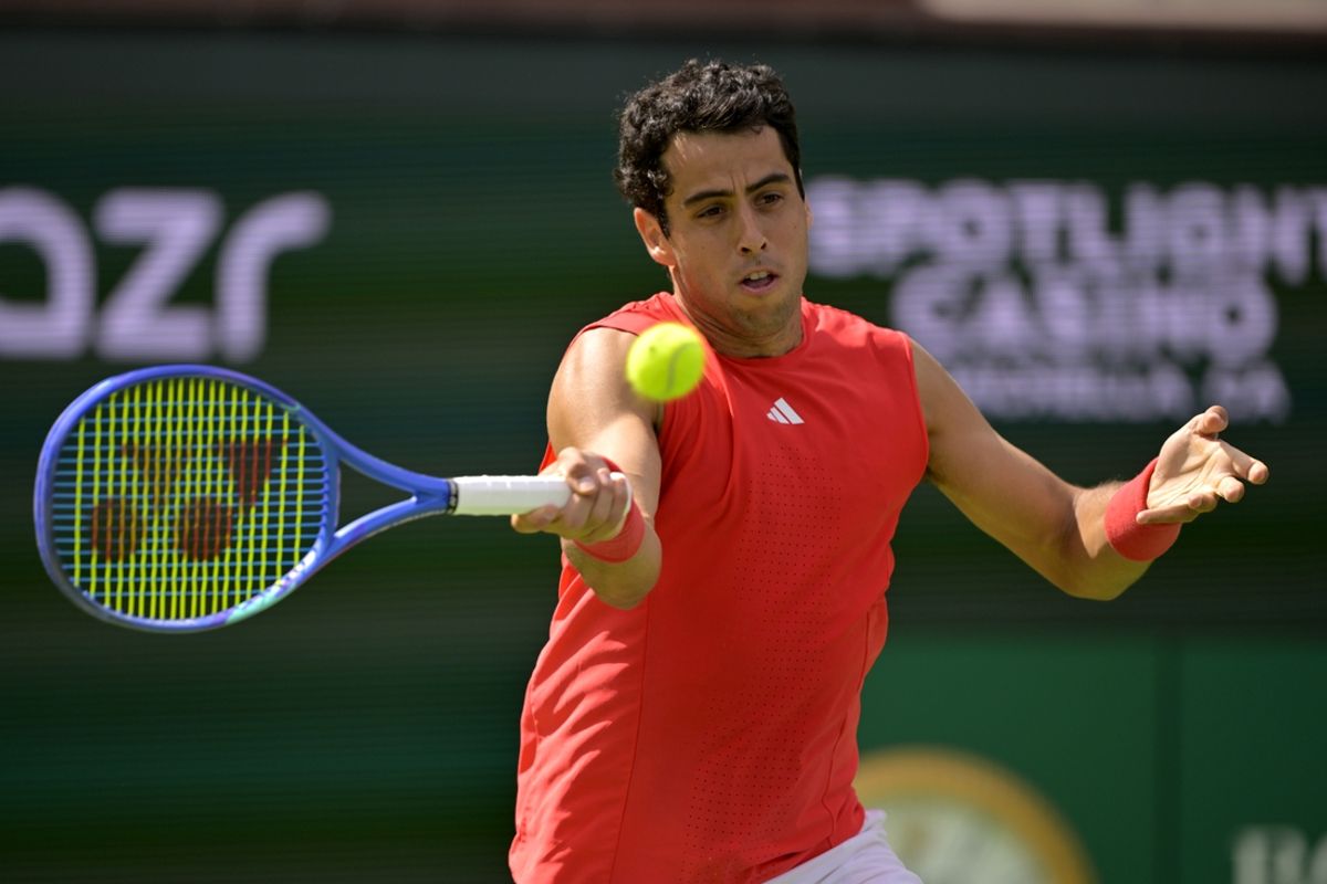 Mar 5, 2025; Indian Wells, CA, USA;  Jaume Munar (ESP) hits a shot against Kei Nishikori (not pictured) in his first round match during the BNP Paribas Open at the Indian Well Tennis Garden. Mandatory Credit: Jayne Kamin-Oncea-Imagn Images