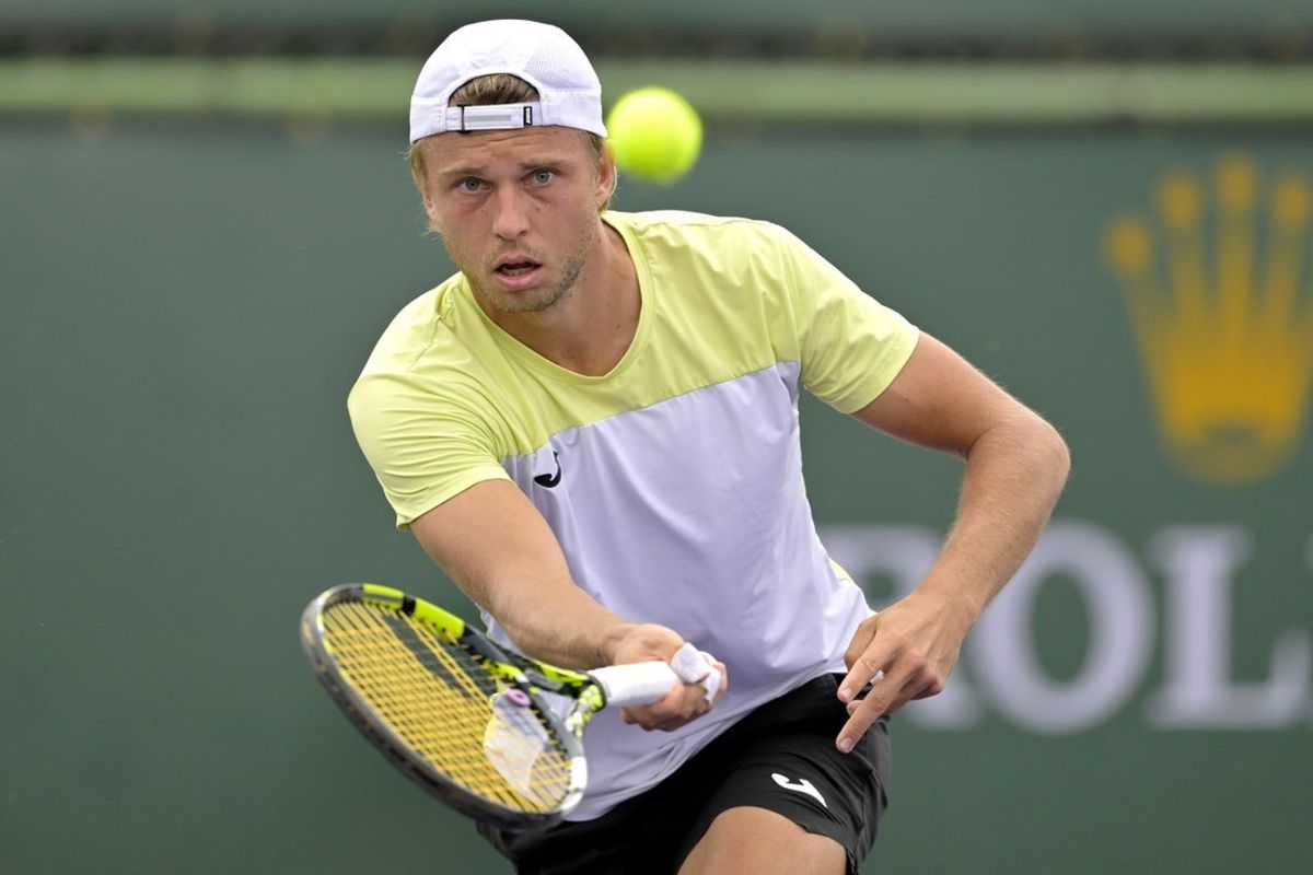 Mar 5, 2025; Indian Wells, CA, USA;  Alexandre Muller (FRA) hits a shot against Seyboth Wild (not pictured) in his first round match during the BNP Paribas Open at the Indian Well Tennis Garden. Mandatory Credit: Jayne Kamin-Oncea-Imagn Images