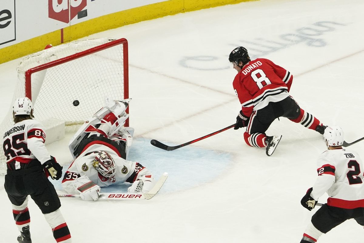 Mar 5, 2025; Chicago, Illinois, USA; Chicago Blackhawks center Ryan Donato (8) scores a goal on Ottawa Senators goaltender Linus Ullmark (35) during the first period at United Center. Mandatory Credit: David Banks-Imagn Images