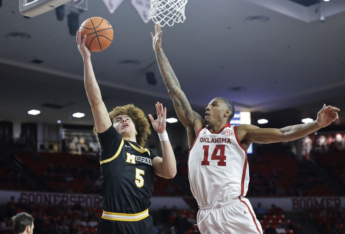 Mar 5, 2025; Norman, Oklahoma, USA; Missouri Tigers guard T.O. Barrett (5) shoots the ball as Oklahoma Sooners forward Jalon Moore (14) defends during the first half at Lloyd Noble Center. Mandatory Credit: Alonzo Adams-Imagn Images