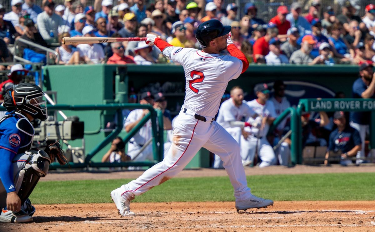 Mar 2, 2025; Fort Myers, Florida, USA; Boston Red Sox Alex Bregman (2) connects with the ball for a single during the first inning of their game with the New York Mets at JetBlue Park at Fenway South. Mandatory Credit: Chris Tilley-Imagn Images
