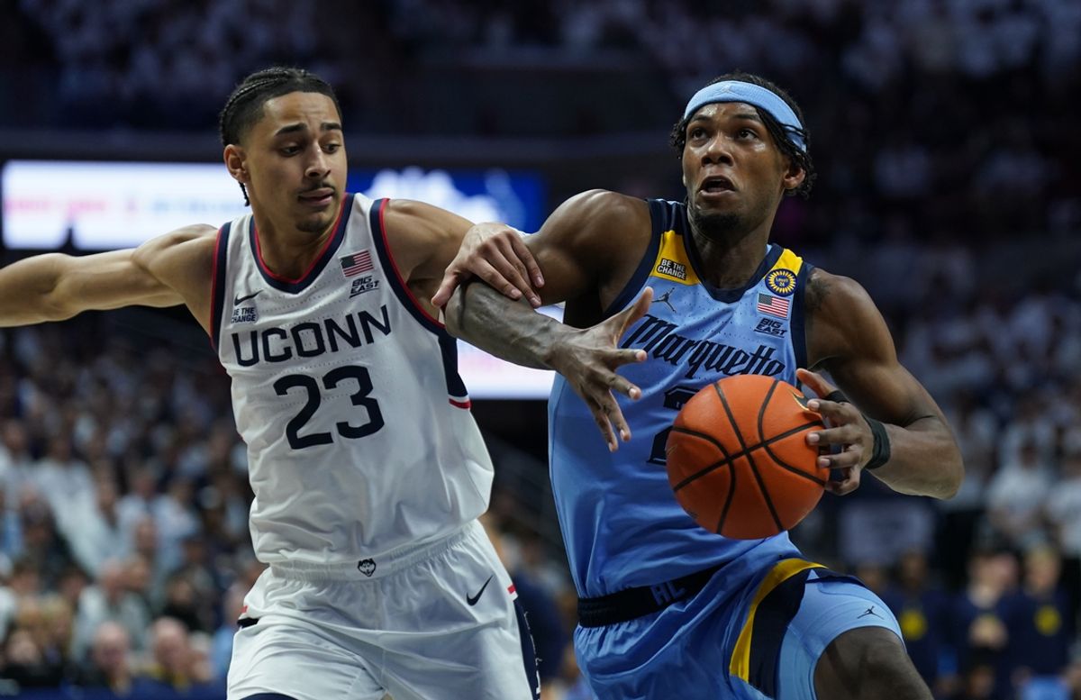 Mar 5, 2025; Storrs, Connecticut, USA; Marquette Golden Eagles guard Chase Ross (2) drives the ball to the basket against UConn Huskies forward Jayden Ross (23) in the first half at Harry A. Gampel Pavilion. Mandatory Credit: David Butler II-Imagn Images