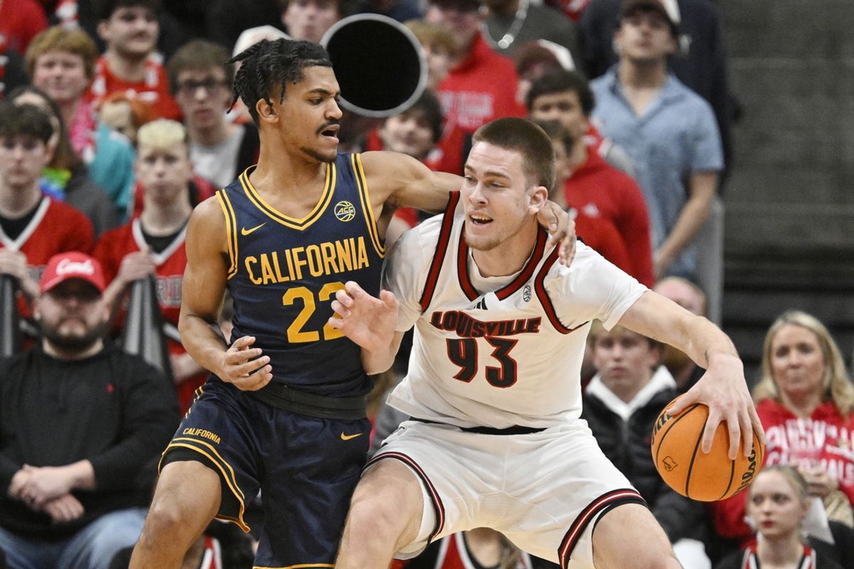 Mar 5, 2025; Louisville, Kentucky, USA;  Louisville Cardinals forward Noah Waterman (93) posts up against California Golden Bears guard Christian Tucker (22) during the first half at KFC Yum! Center. Mandatory Credit: Jamie Rhodes-Imagn Images