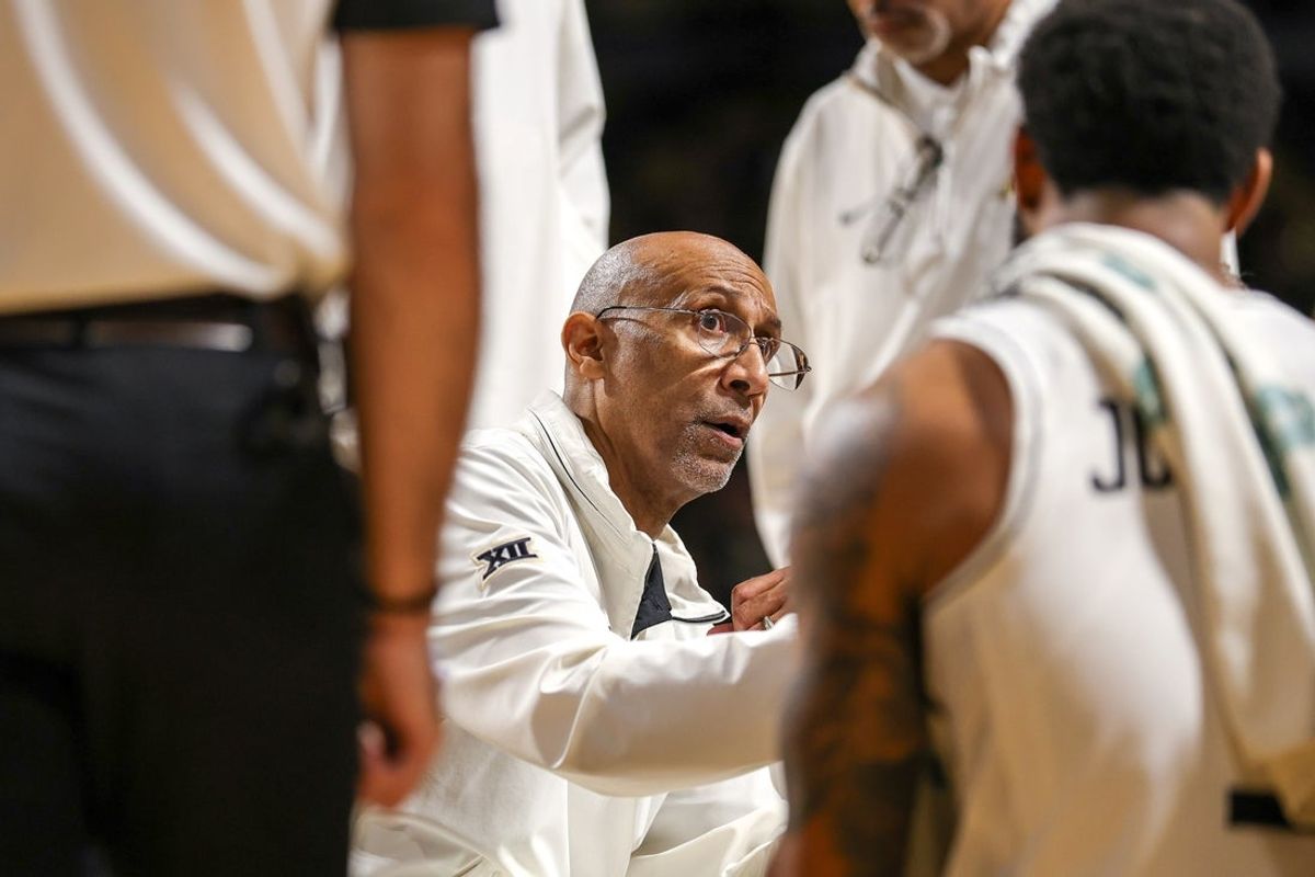Mar 5, 2025; Orlando, Florida, USA; UCF Knights head coach Johnny Dawkins talks to the team in the second half during a timeout against the Oklahoma State Cowboys at Addition Financial Arena. Mandatory Credit: Mike Watters-Imagn Images