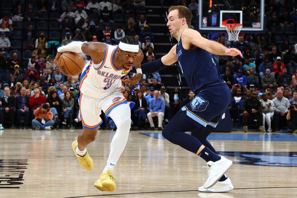 Mar 5, 2025; Memphis, Tennessee, USA; Oklahoma City Thunder guard Shai Gilgeous-Alexander (2) drives to the basket as Memphis Grizzlies guard Luke Kennard (10) defends during the first quarter at FedExForum. Mandatory Credit: Petre Thomas-Imagn Images