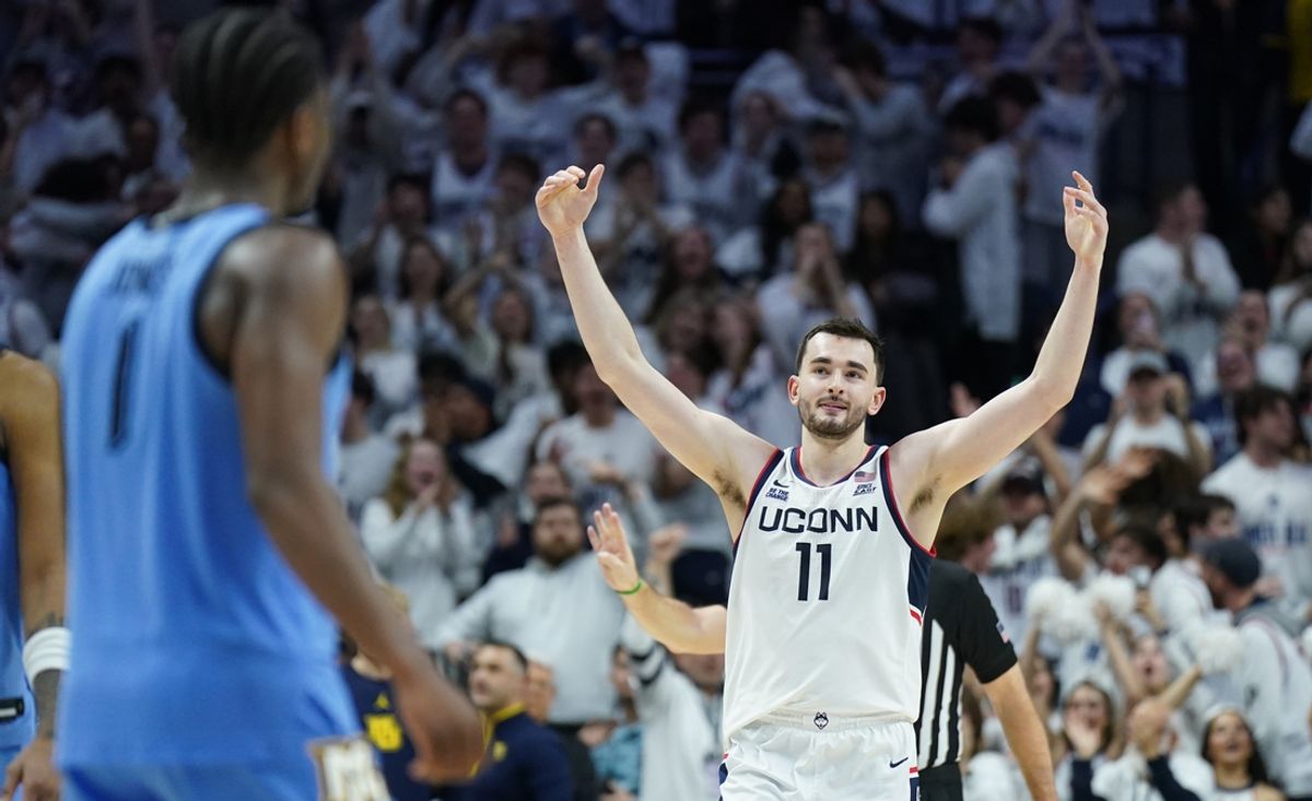 Mar 5, 2025; Storrs, Connecticut, USA; UConn Huskies forward Alex Karaban (11) reacts after his three point basket against the Marquette Golden Eagles in the second half at Harry A. Gampel Pavilion. Mandatory Credit: David Butler II-Imagn Images