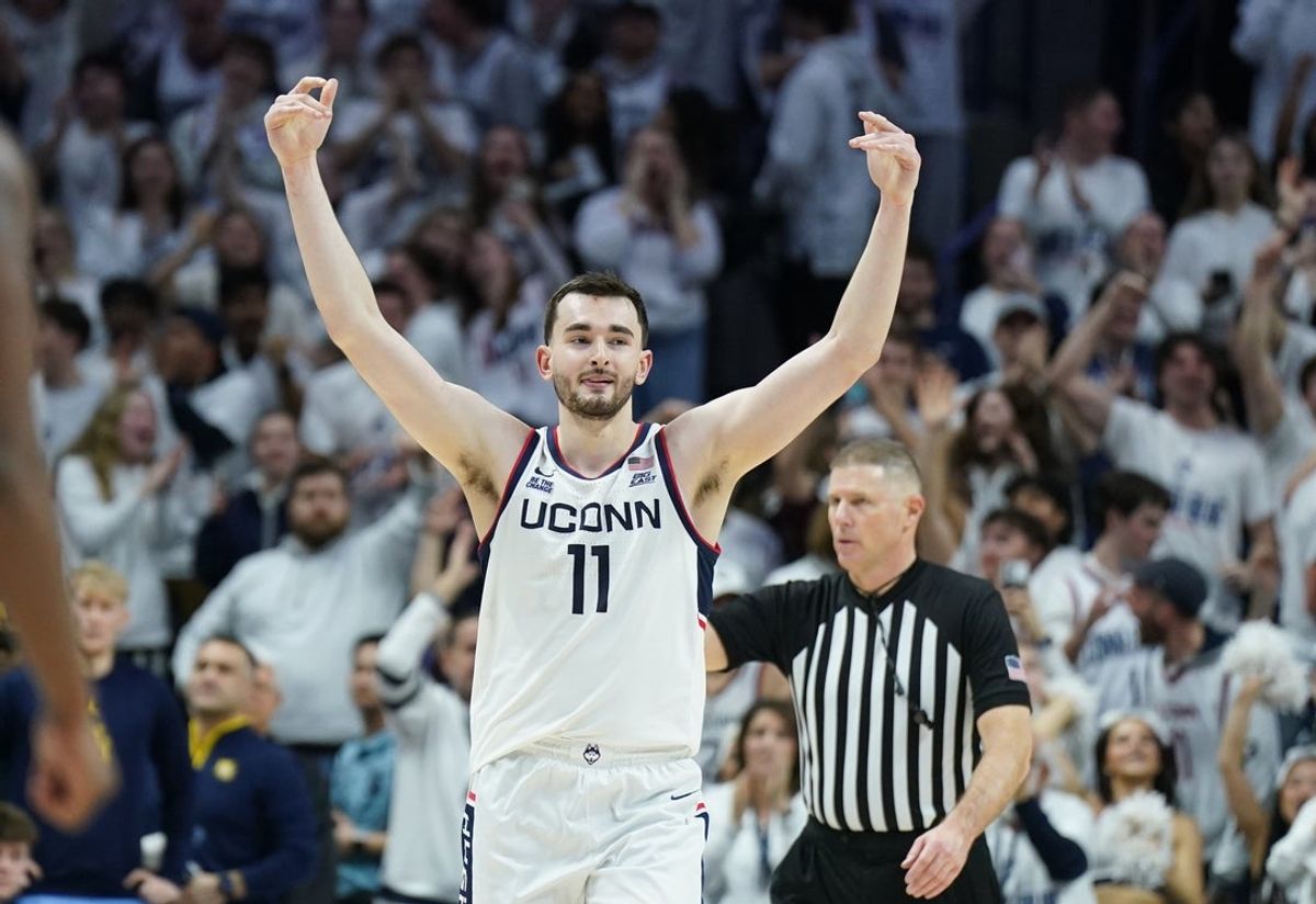 Mar 5, 2025; Storrs, Connecticut, USA; UConn Huskies forward Alex Karaban (11) reacts after his three point basket against the Marquette Golden Eagles in the second half at Harry A. Gampel Pavilion. Mandatory Credit: David Butler II-Imagn Images