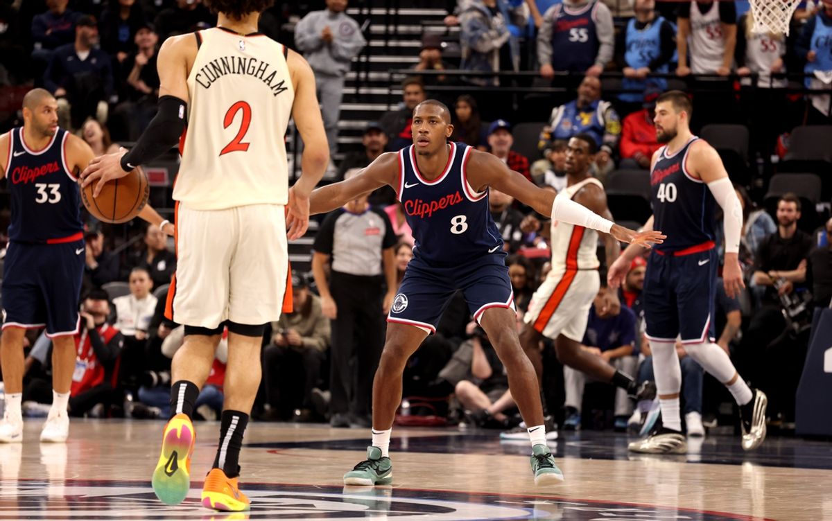 Mar 5, 2025; Inglewood, California, USA; LA Clippers guard Kris Dunn (8) defends Detroit Pistons guard Cade Cunningham (2) during the second quarter at Intuit Dome. Mandatory Credit: Jason Parkhurst-Imagn Images
