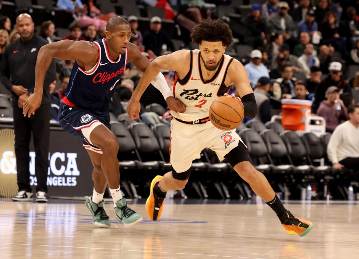 Mar 5, 2025; Inglewood, California, USA; Detroit Pistons guard Cade Cunningham (2) drives against LA Clippers guard Kris Dunn (8) during the third quarter at Intuit Dome. Mandatory Credit: Jason Parkhurst-Imagn Images