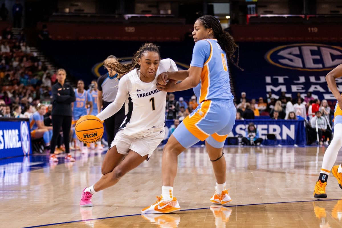 Mar 6, 2025; Greenville, SC, USA; Vanderbilt Commodores guard Mikayla Blakes (1) drives on Tennessee Lady Vols guard Jewel Spear (0) during the second half at Bon Secours Wellness Arena. Mandatory Credit: Scott Kinser-Imagn Images