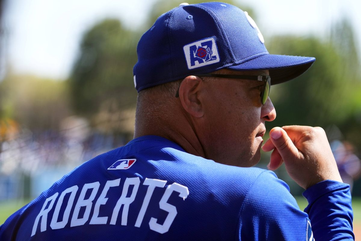 Mar 6, 2025; Phoenix, Arizona, USA; Los Angeles Dodgers manager Dave Roberts (30) looks on against the Texas Rangers during the third inning at Camelback Ranch-Glendale. Mandatory Credit: Joe Camporeale-Imagn Images