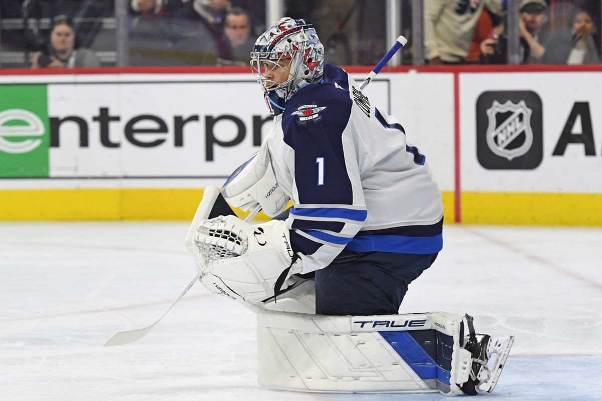 Mar 6, 2025; Philadelphia, Pennsylvania, USA; Winnipeg Jets goaltender Eric Comrie (1) against the Philadelphia Flyers during the first period at Wells Fargo Center. Mandatory Credit: Eric Hartline-Imagn Images