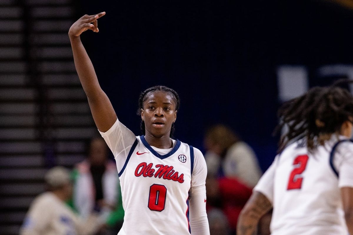 Mar 6, 2025; Greenville, SC, USA; Ole Miss Rebels guard Sira Thienou (0) celebrates a three during the first half against the Mississippi State Bulldogs at Bon Secours Wellness Arena. Mandatory Credit: Scott Kinser-Imagn Images