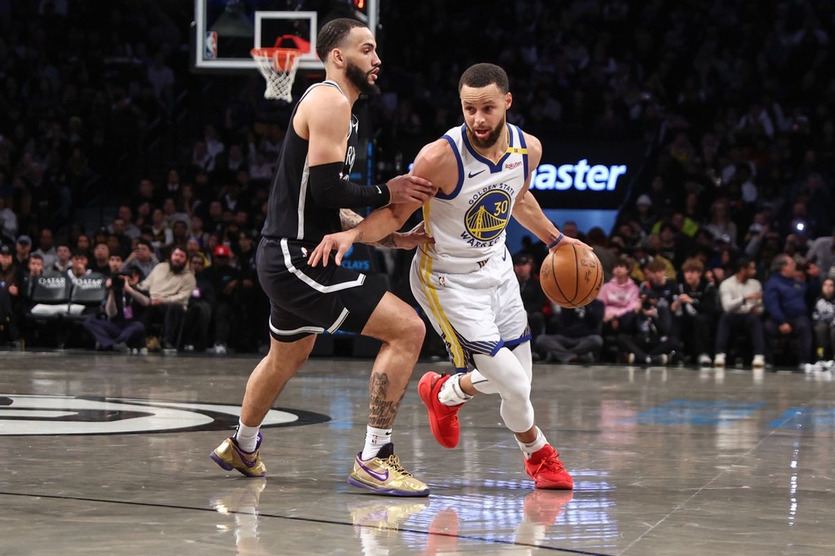 Mar 6, 2025; Brooklyn, New York, USA;  Golden State Warriors guard Stephen Curry (30) drives past Brooklyn Nets guard Tyrese Martin (13) in the first quarter at Barclays Center. Mandatory Credit: Wendell Cruz-Imagn Images