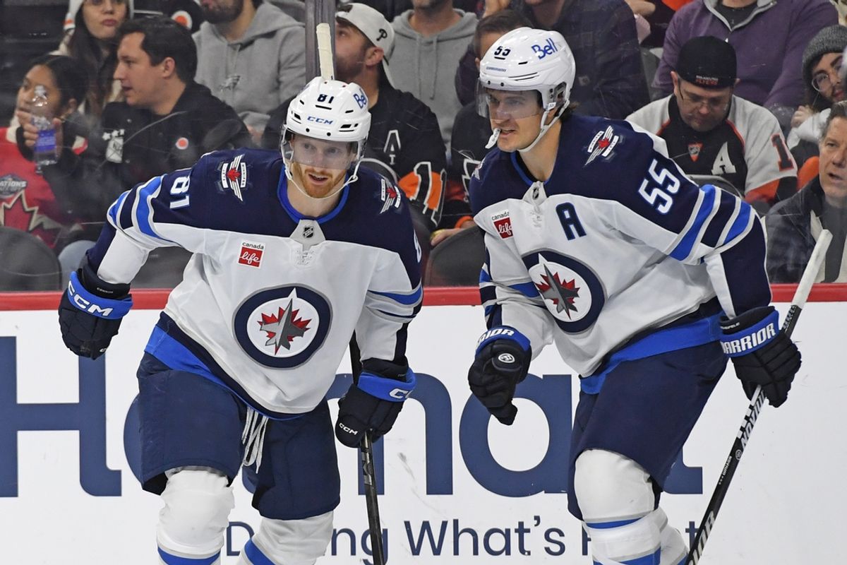 Mar 6, 2025; Philadelphia, Pennsylvania, USA; Winnipeg Jets left wing Kyle Connor (81) celebrates his goal with center Mark Scheifele (55) against the Philadelphia Flyers during the second period at Wells Fargo Center. Mandatory Credit: Eric Hartline-Imagn Images