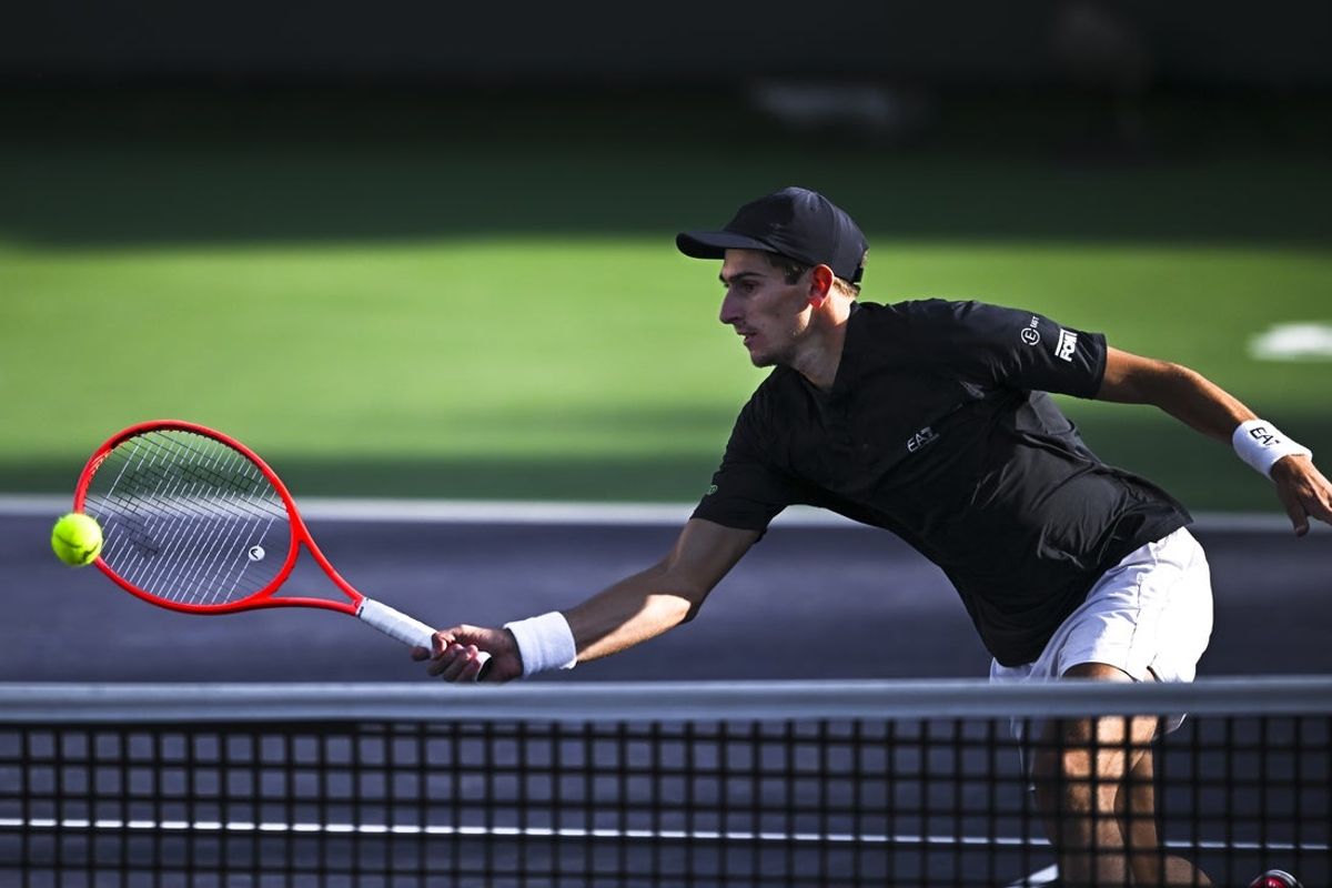 Mar 6, 2025; Indian Wells, CA, USA; Matteo Arnaldi (ITA) hits a ball against Aleksander Kovacevic (USA) in the BNP Paribas Open at the Indian Well Tennis Garden. Mandatory Credit: Jonathan Hui-Imagn Images