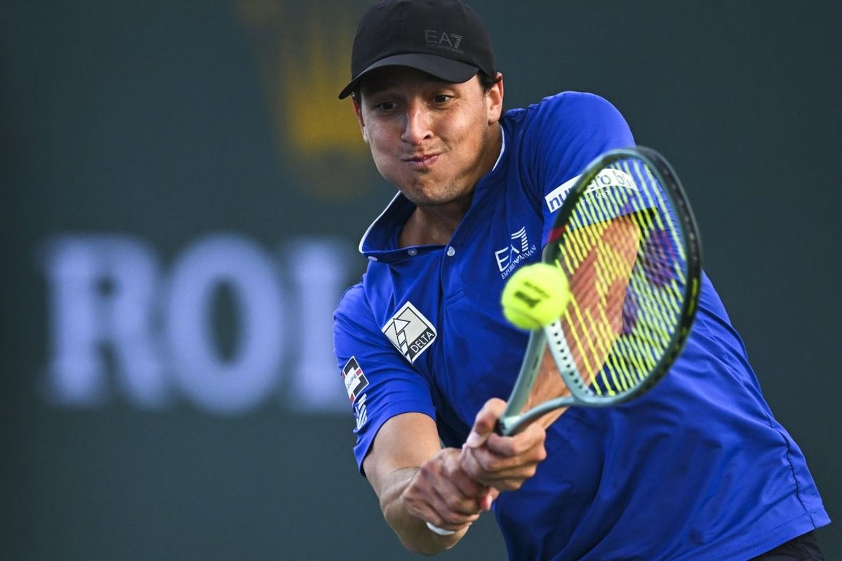 Mar 6, 2025; Indian Wells, CA, USA; Luciano Darderi (ITA) hits a ball against Hugo Gaston (FRA) in the BNP Paribas Open at the Indian Well Tennis Garden. Mandatory Credit: Jonathan Hui-Imagn Images