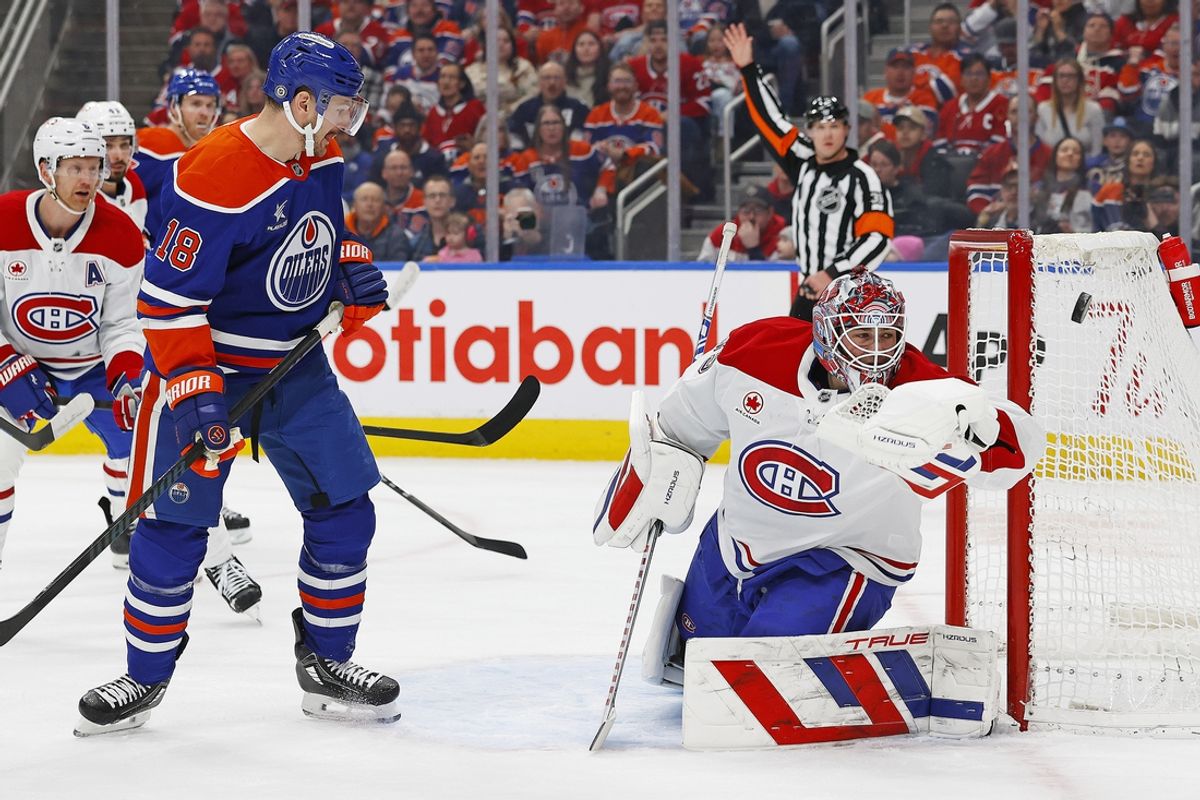 Mar 6, 2025; Edmonton, Alberta, CAN; Edmonton Oilers forward Zach Hyman (18) watches a shot go just wide of Montreal Canadiens goaltender Sam Montembeault (35) during the first period at Rogers Place. Mandatory Credit: Perry Nelson-Imagn Images
