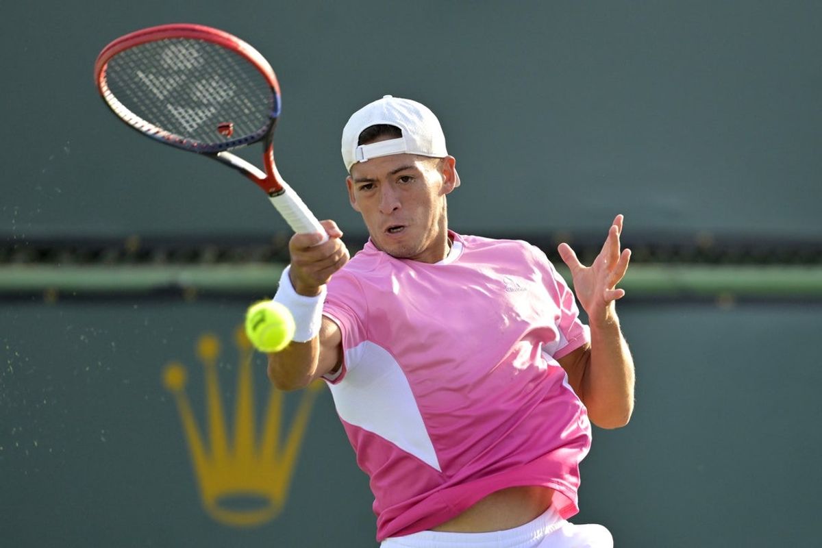 Mar 6, 2025; Indian Wells, CA, USA;  Sebastian Baez (ARG) hits a shot during first round match against Matteo Gigante (not pictured) in the BNP Paribas Open at the Indian Well Tennis Garden. Mandatory Credit: Jayne Kamin-Oncea-Imagn Images