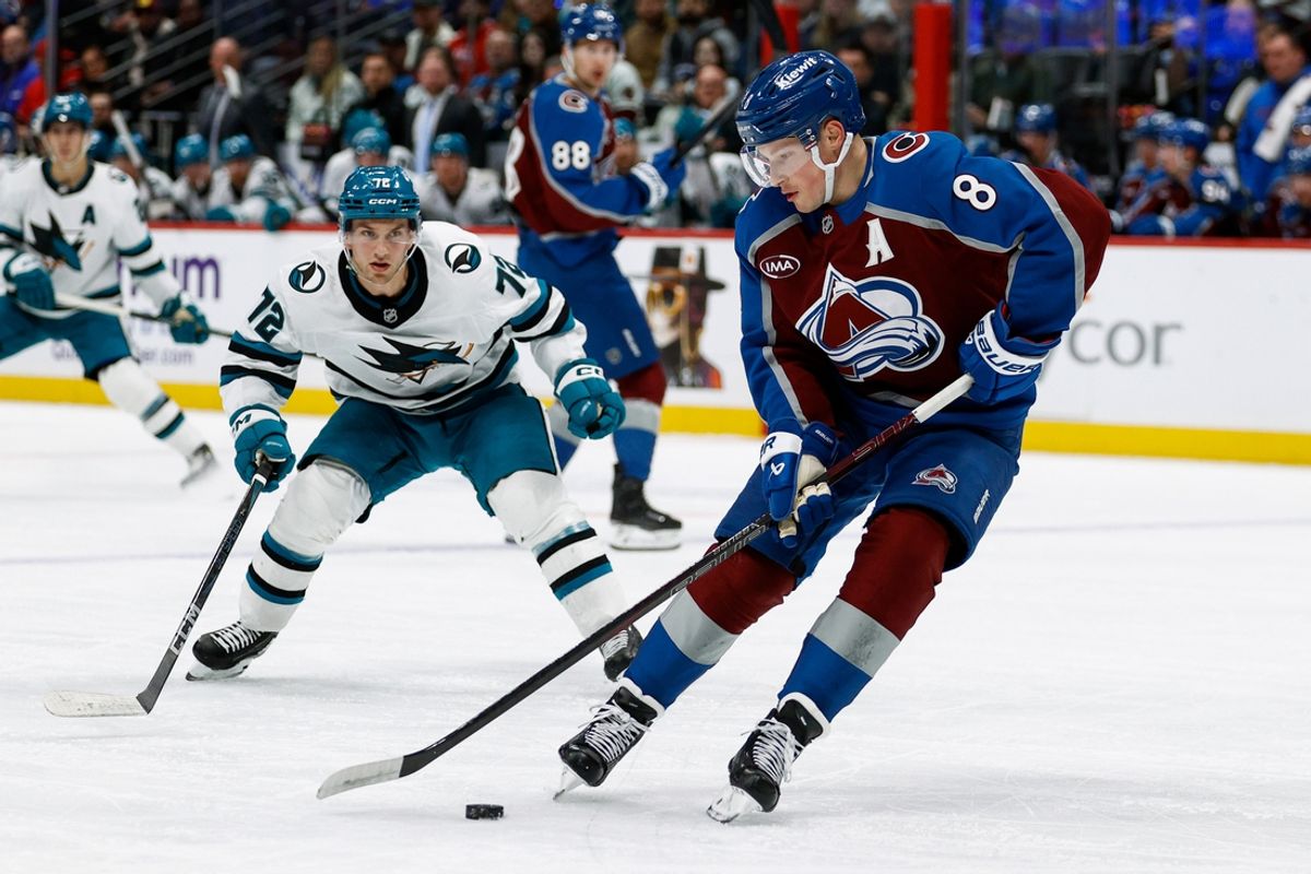 Mar 6, 2025; Denver, Colorado, USA; Colorado Avalanche defenseman Cale Makar (8) controls the puck ahead of San Jose Sharks left wing William Eklund (72) in the first period at Ball Arena. Mandatory Credit: Isaiah J. Downing-Imagn Images