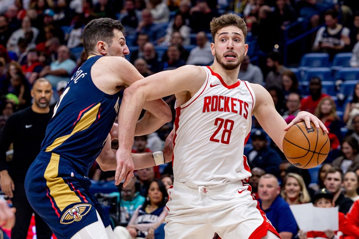 Mar 6, 2025; New Orleans, Louisiana, USA;  Houston Rockets center Alperen Sengun (28) dribbles against New Orleans Pelicans center Karlo Matkovic (17) during the second half at Smoothie King Center. Mandatory Credit: Stephen Lew-Imagn Images