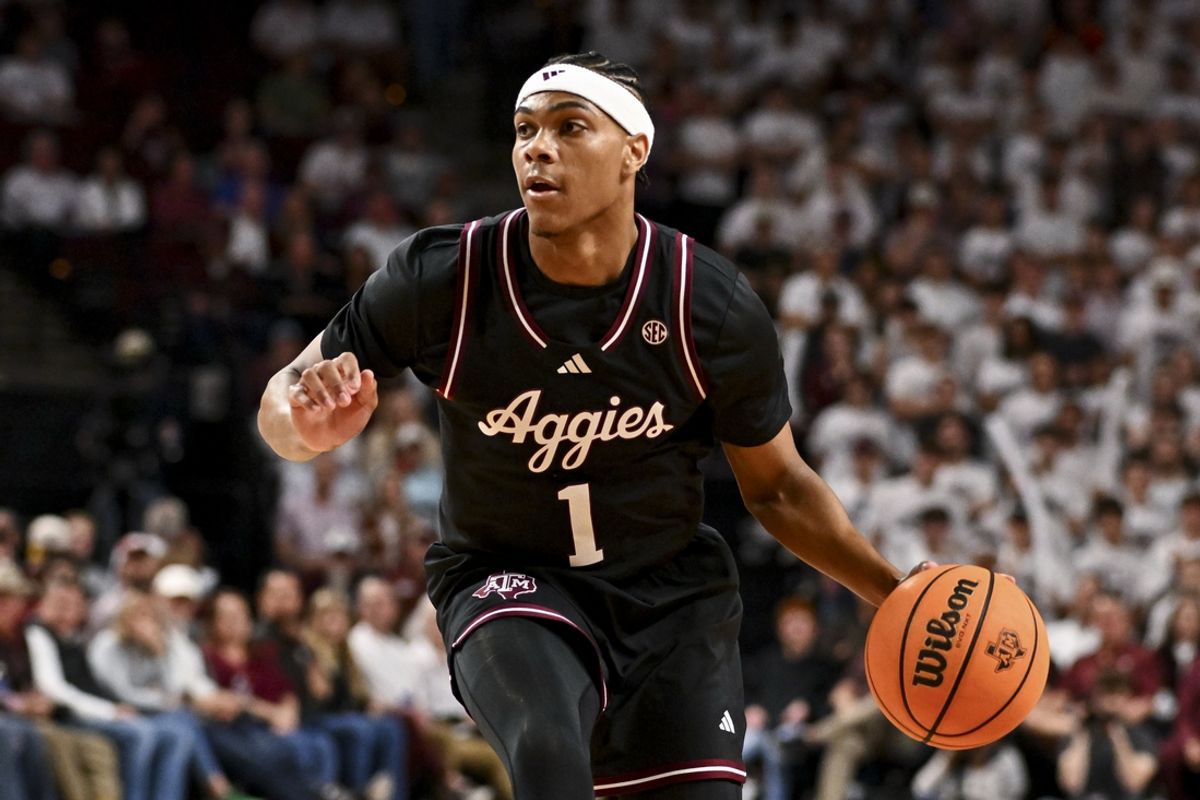 Mar 4, 2025; College Station, Texas, USA; Texas A&M Aggies guard Zhuric Phelps (1) dribbles the ball during the first half against the Auburn Tigers at Reed Arena. Mandatory Credit: Maria Lysaker-Imagn Images