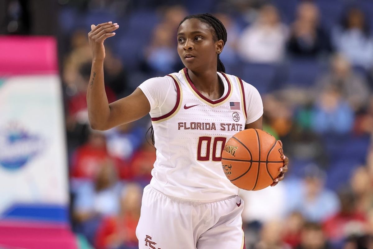 Mar 7, 2025; Greensboro, NC, USA;  Florida State Seminoles guard Ta'Niya Latson (00) sets the play during the third quarter against North Carolina Tar Heels at First Horizon Coliseum. Mandatory Credit: Cory Knowlton-Imagn Images