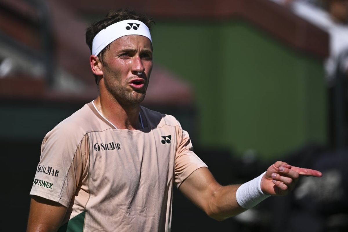 Mar 7, 2025; Indian Wells, CA, USA; Casper Ruud (NOR) points out distractions to the umpire against Marcos Giron (USA) at Indian Well Tennis Garden. Mandatory Credit: Jonathan Hui-Imagn Images