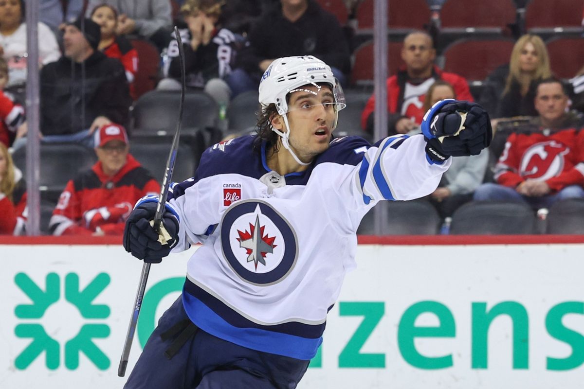 Mar 7, 2025; Newark, New Jersey, USA; Winnipeg Jets left wing Brandon Tanev (73) celebrates a goal by Winnipeg Jets left wing Alex Iafallo (9) (not shown) against the New Jersey Devils during the first period at Prudential Center. Mandatory Credit: Ed Mulholland-Imagn Images