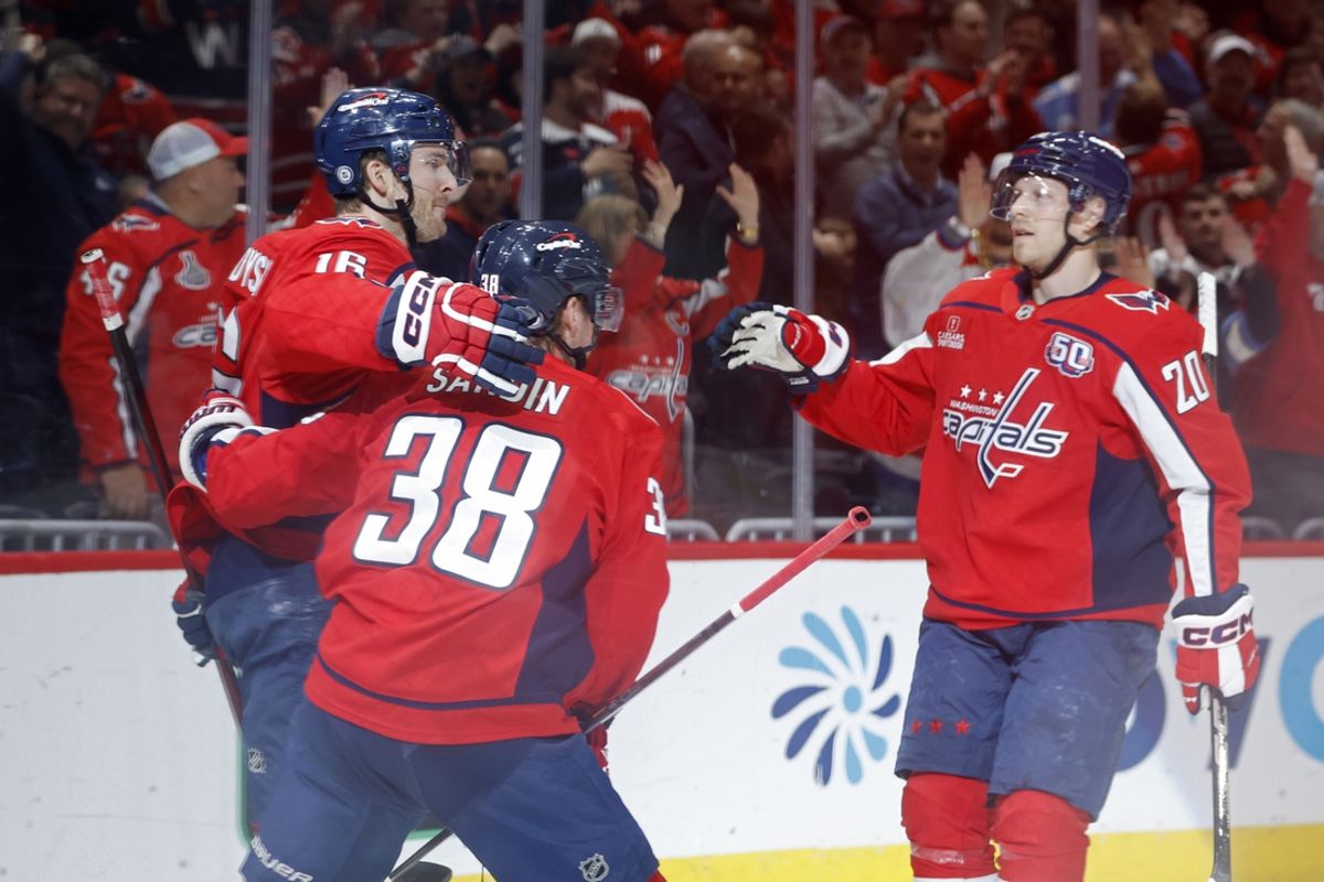 Mar 7, 2025; Washington, District of Columbia, USA; Washington Capitals right wing Taylor Raddysh (16) celebrates with teammates after scoring a goal against the Detroit Red Wings in the first period at Capital One Arena. Mandatory Credit: Geoff Burke-Imagn Images