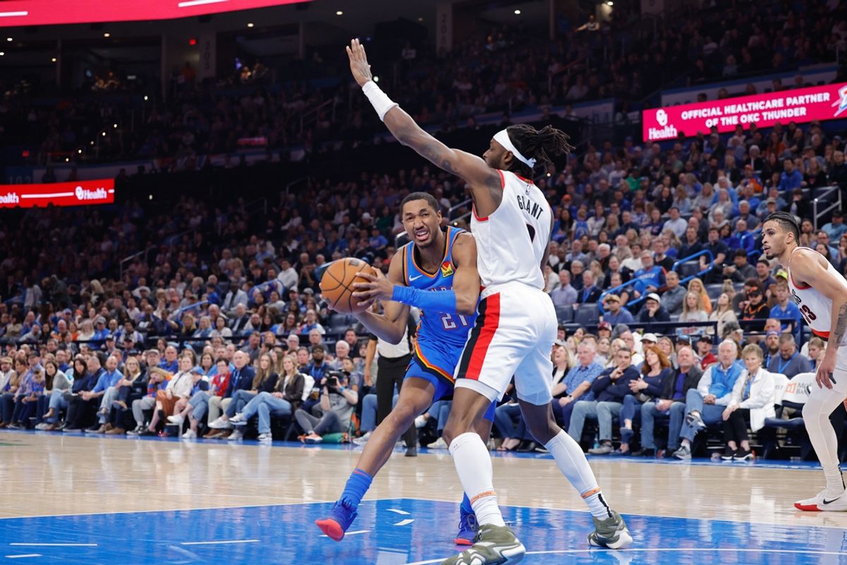 Mar 7, 2025; Oklahoma City, Oklahoma, USA; Oklahoma City Thunder guard Aaron Wiggins (21) drives to the basket against Portland Trail Blazers forward Jerami Grant (9) during the second quarter at Paycom Center. Mandatory Credit: Alonzo Adams-Imagn Images