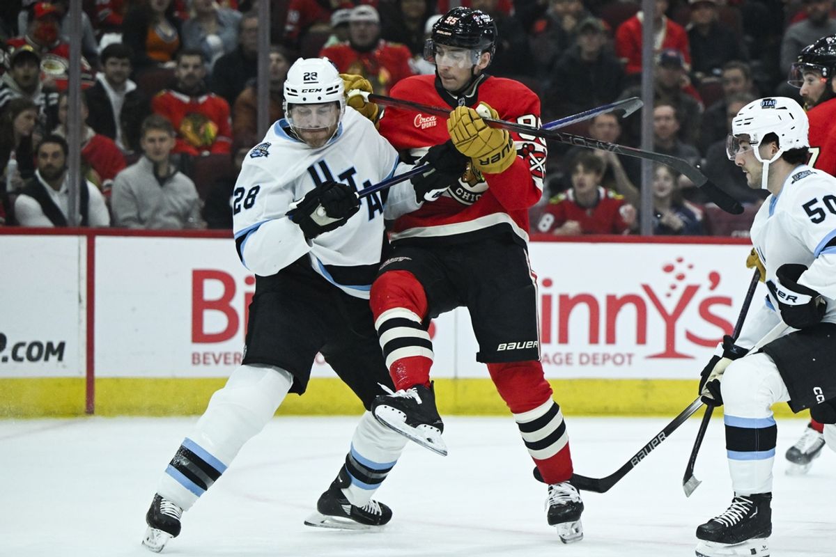 Mar 7, 2025; Chicago, Illinois, USA;  Utah Hockey Club defenseman Ian Cole (28) and Chicago Blackhawks right wing Ilya Mikheyev (95) bump into each other during the first period at the United Center. Mandatory Credit: Matt Marton-Imagn Images