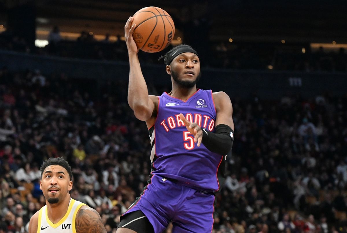 Mar 7, 2025; Toronto, Ontario, CAN; Toronto Raptors guard Immanuel Quickley (5) prepares to pass the ball against the Utah Jazz in the first half at Scotiabank Arena. Mandatory Credit: Dan Hamilton-Imagn Images
