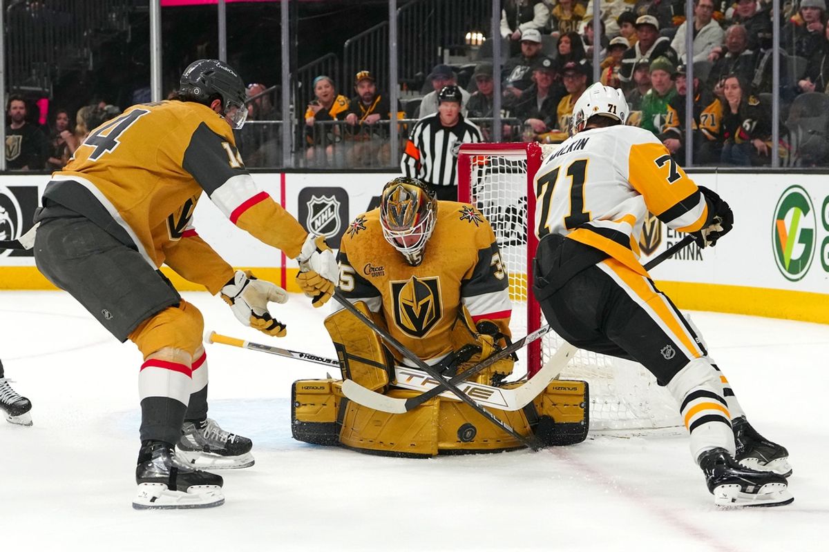 Mar 7, 2025; Las Vegas, Nevada, USA; Vegas Golden Knights goaltender Ilya Samsonov (35) makes a save against Pittsburgh Penguins center Evgeni Malkin (71) next to Vegas Golden Knights defenseman Nicolas Hague (14) during the first period at T-Mobile Arena. Mandatory Credit: Stephen R. Sylvanie-Imagn Images