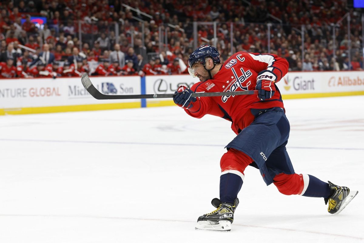 Mar 7, 2025; Washington, District of Columbia, USA; Washington Capitals left wing Alex Ovechkin (8) shoots the puck against the Detroit Red Wings in the third period at Capital One Arena. Mandatory Credit: Geoff Burke-Imagn Images