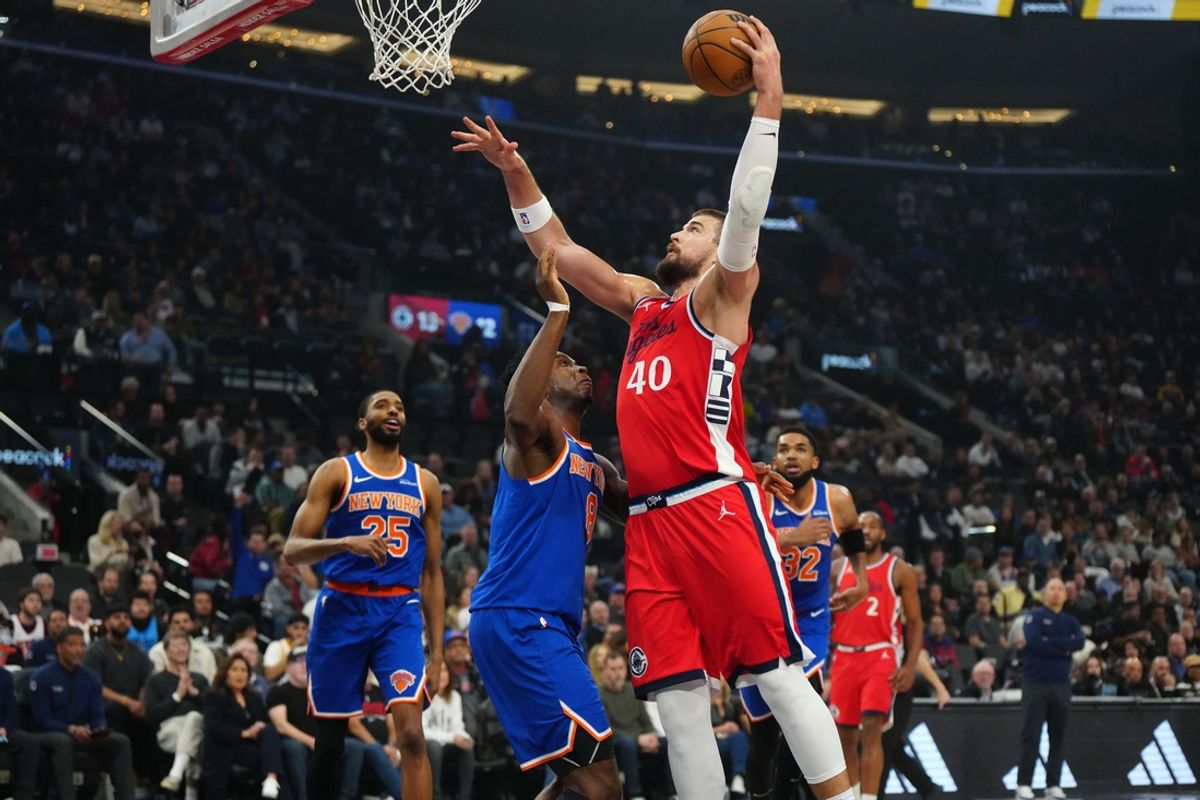 Mar 7, 2025; Inglewood, California, USA; LA Clippers center Ivica Zubac (40) shoots the ball against New York Knicks forward OG Anunoby (8) in the first half at Intuit Dome. Mandatory Credit: Kirby Lee-Imagn Images