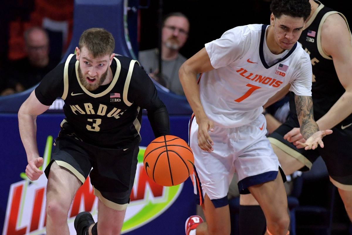 Mar 7, 2025; Champaign, Illinois, USA;  Purdue Boilermakers guard Braden Smith (3) races the ball up court as Illinois Fighting Illini forward Will Riley (7) pursues during the second half at State Farm Center. Mandatory Credit: Ron Johnson-Imagn Images
