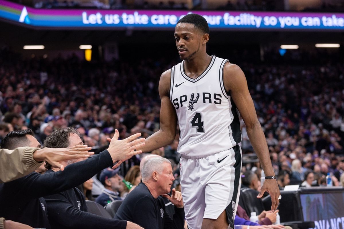 Mar 7, 2025; Sacramento, California, USA; San Antonio Spurs guard De'Aaron Fox (4) high fives team mates after coming out of the game during the fourth quarter at Golden 1 Center. Mandatory Credit: Ed Szczepanski-Imagn Images