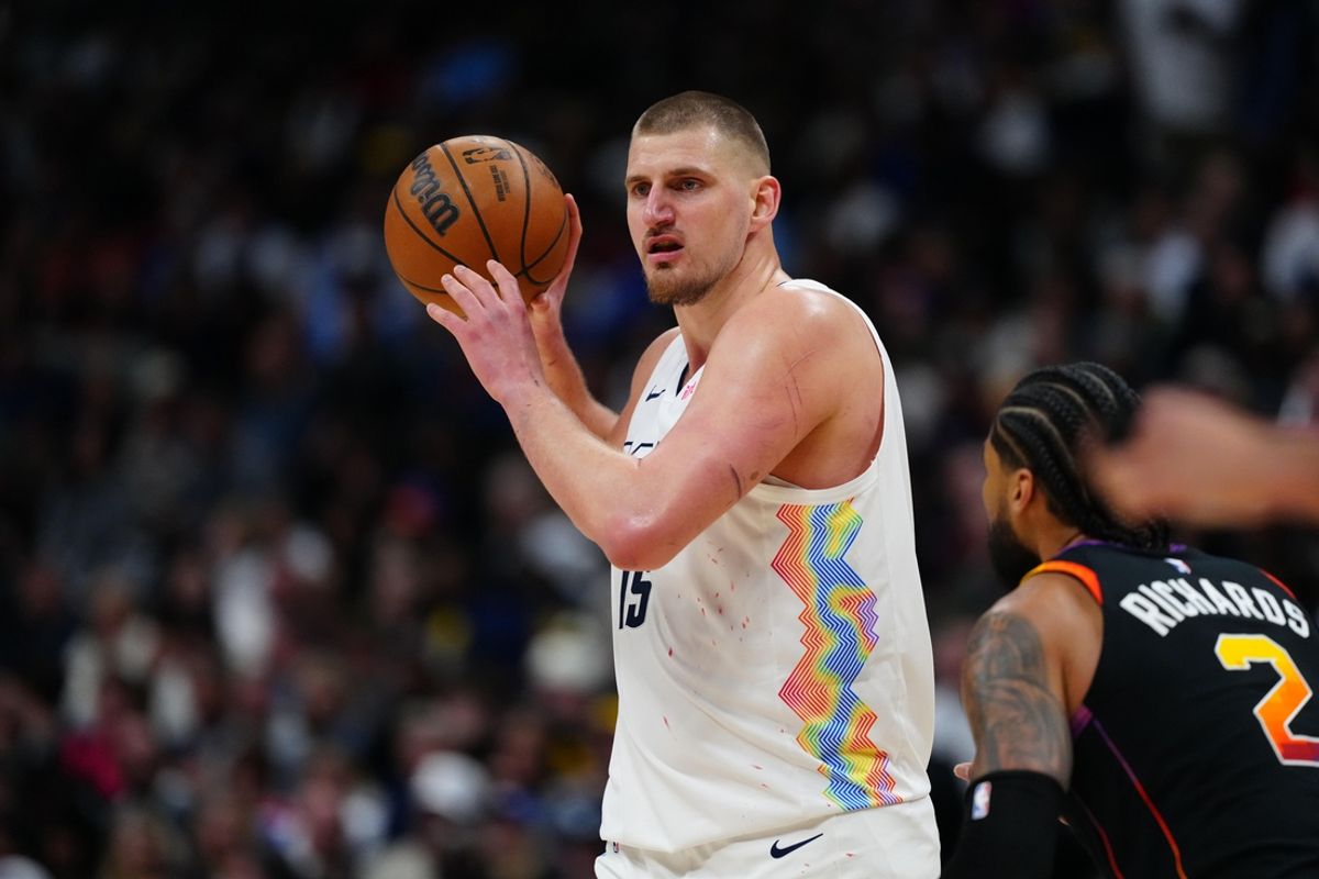 Mar 7, 2025; Denver, Colorado, USA; Denver Nuggets center Nikola Jokic (15) looks to pass the ball in the second half against the Phoenix Suns at Ball Arena. Mandatory Credit: Ron Chenoy-Imagn Images