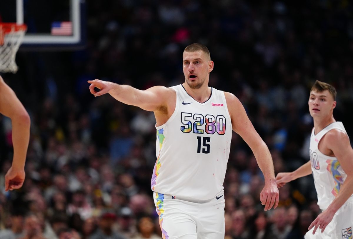 Mar 7, 2025; Denver, Colorado, USA; Denver Nuggets center Nikola Jokic (15) points in the second half against the Phoenix Suns at Ball Arena. Mandatory Credit: Ron Chenoy-Imagn Images